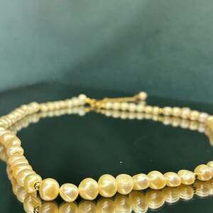 Elegant peach freshwater pearl necklace set in 18k vermeil over 925 sterling.